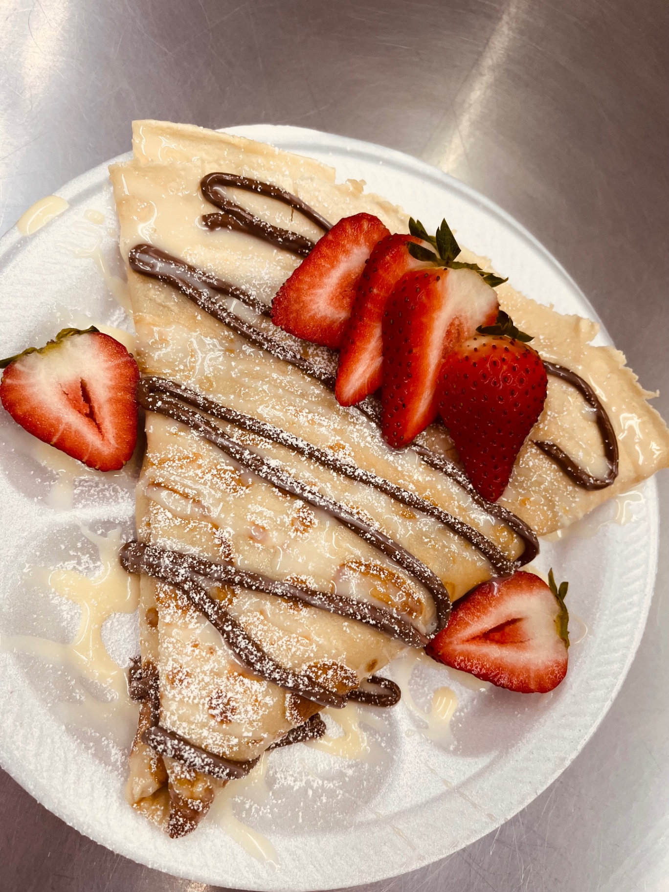 Strawberry crepe with chocolate drizzle