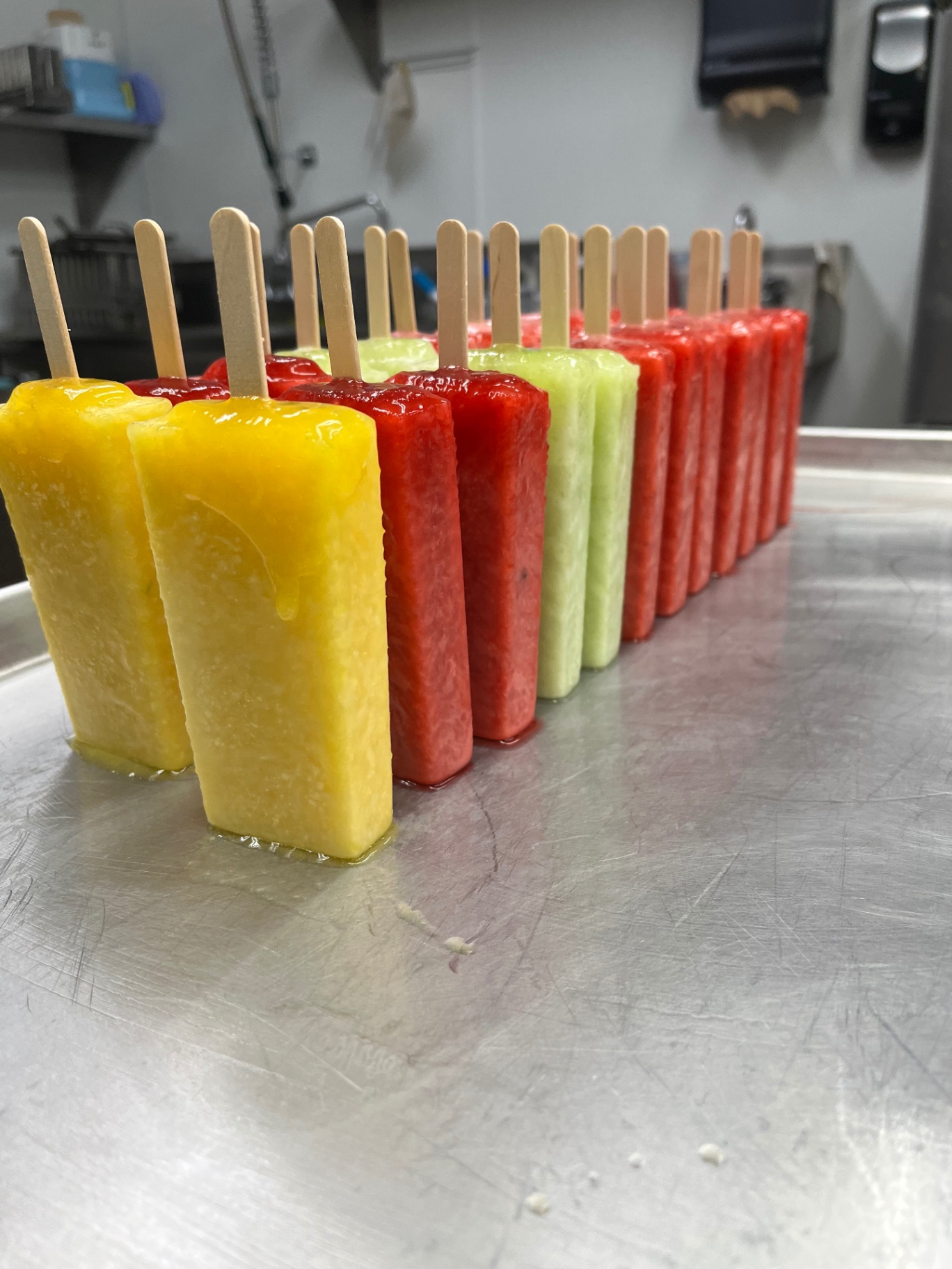 Handmade paletas in bright, fresh-fruit flavors